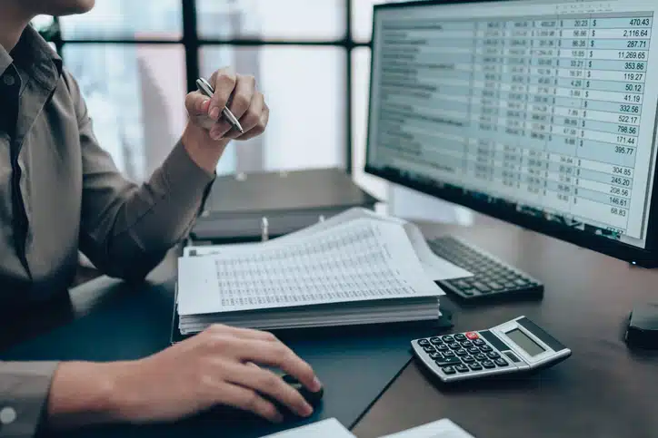 Business Process Outsourcing (BPO) Services 14 Business professional reviewing financial data on a computer