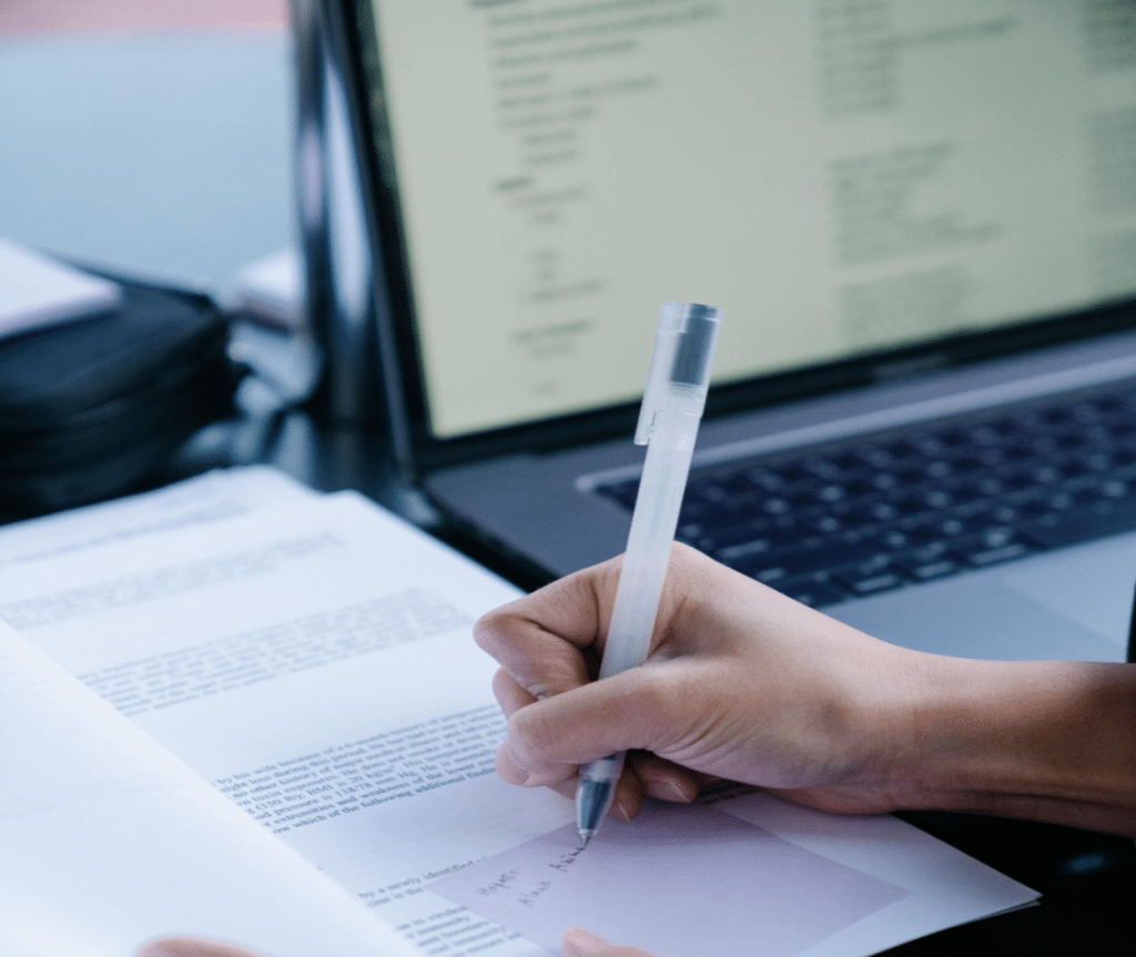 Commercial Debt Collection Process: Step-by-Step Guide 4 Collection specialist using a computer to verify debtor contact information and business data