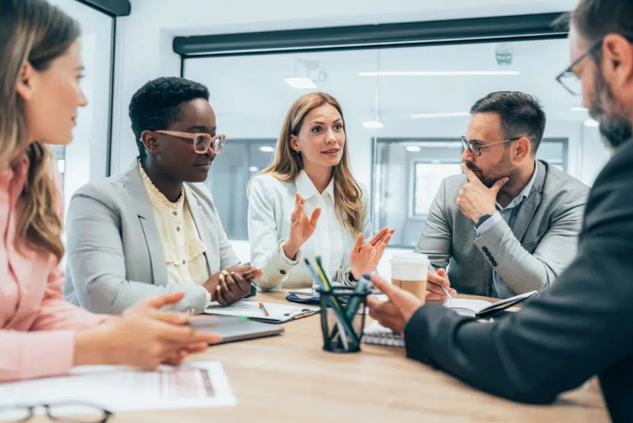 Commercial Collection Agency in Plano, TX: Best Companies, Price & Reviews 3 Business meeting with five professionals around a conference table.