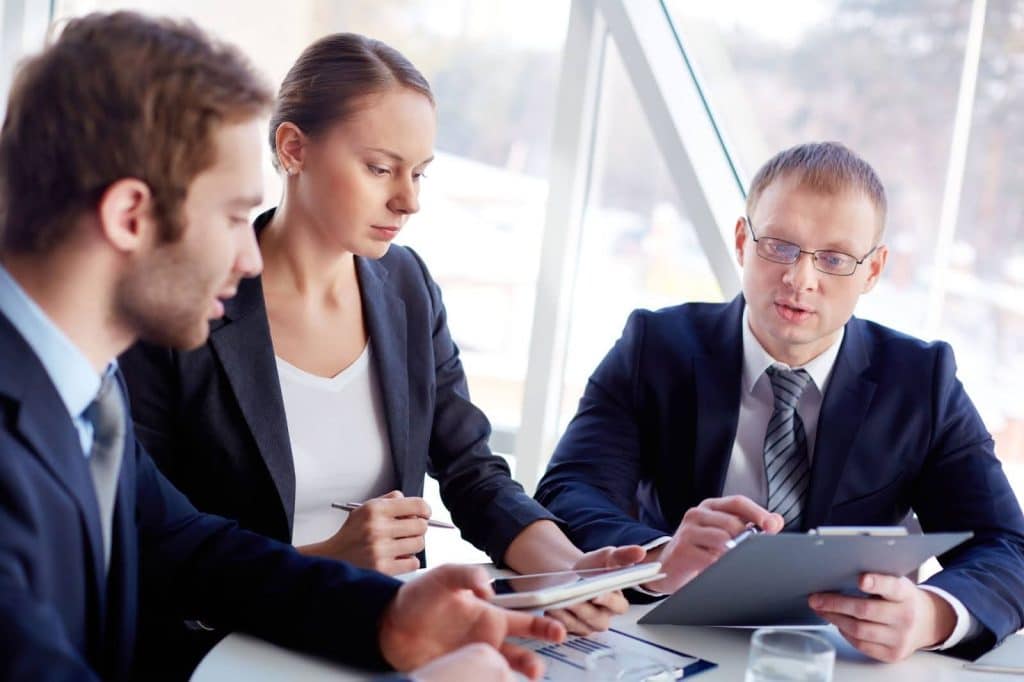 Debt Collection Agency in Mesquite, TX: Top Companies, Cost & Reviews 4 Business professional analyzing financial documents and collection agency fee structures.